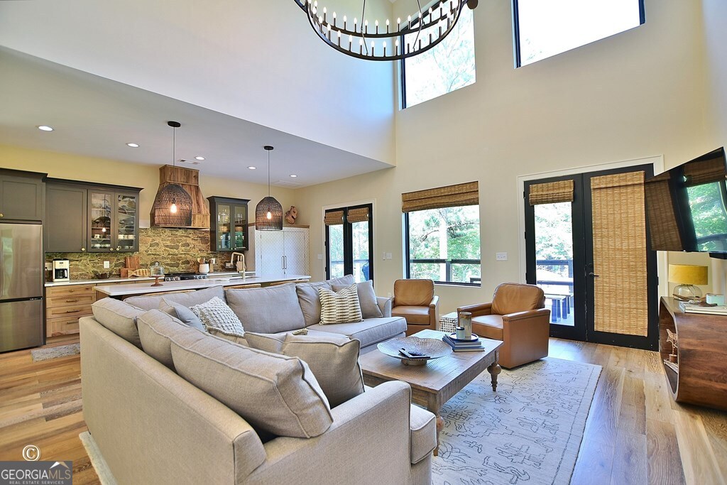 299 Coldivees Road Hamilton, GA 31811 - Photo 7 of 46 a living room with furniture kitchen view and large windows