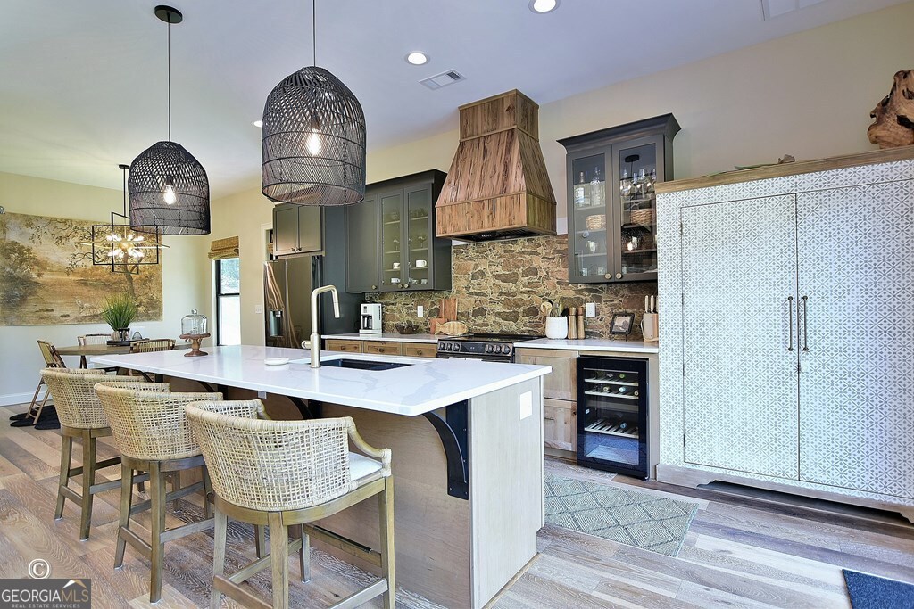 299 Coldivees Road Hamilton, GA 31811 - Photo 10 of 46 a kitchen with kitchen island granite countertop a sink a stove and chairs