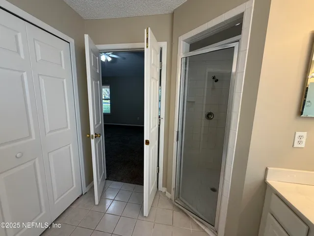 a view of a hallway to rooms