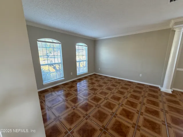 a view of an empty room and window