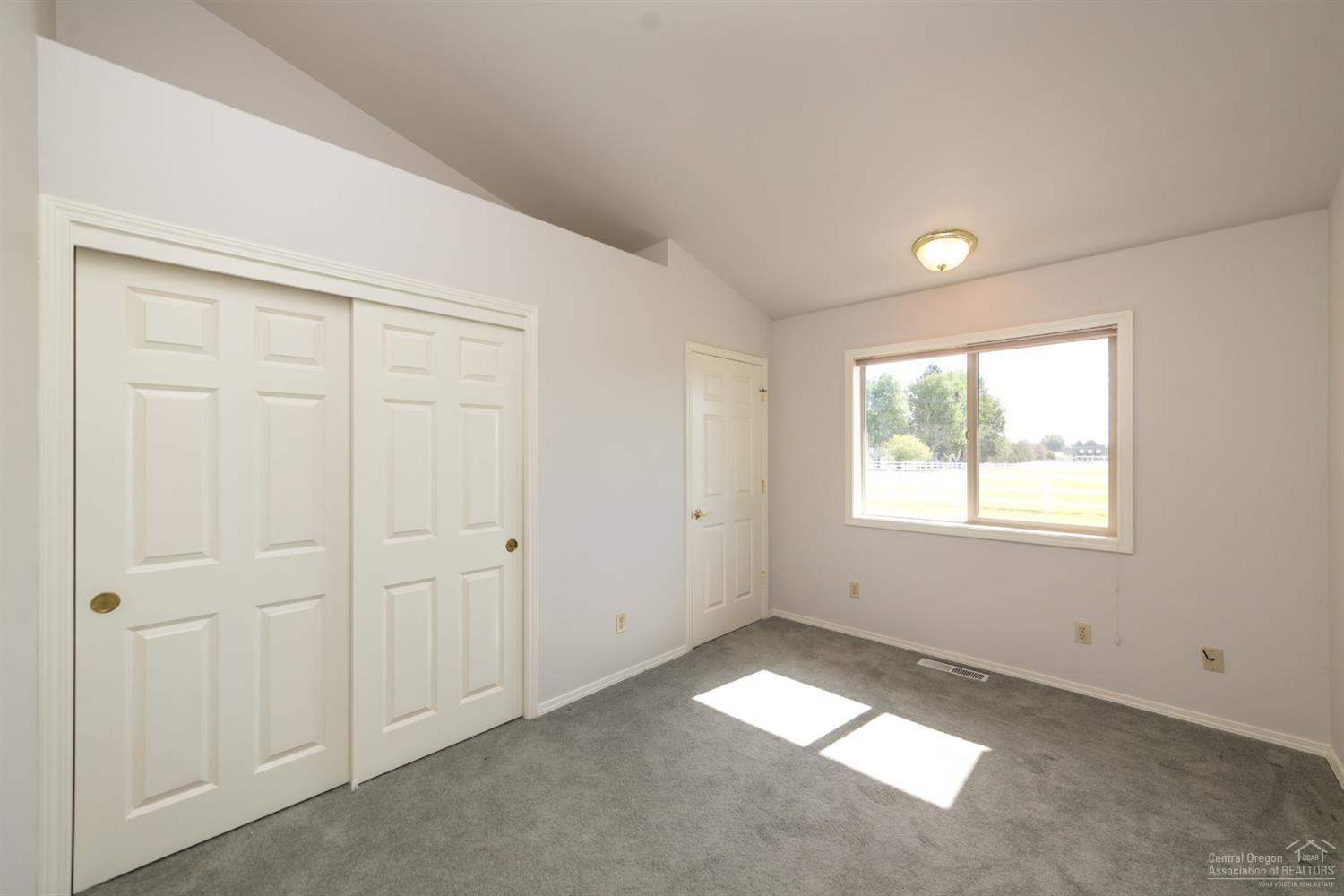 64485 Research Road Bend, OR 97703 - Photo 11 of 18 an empty room with a empty space and windows