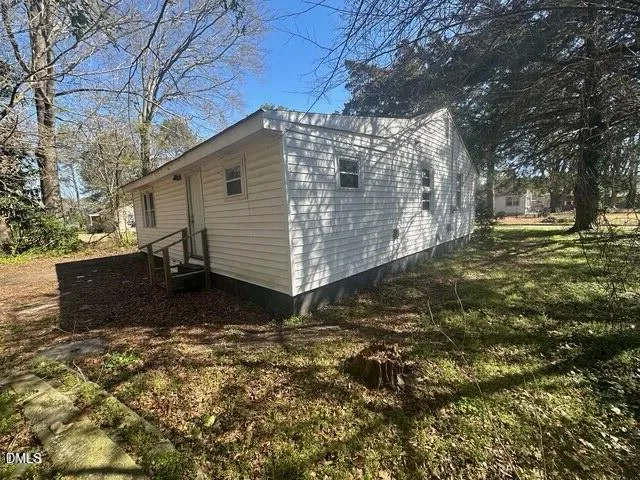 a house with trees in front of it