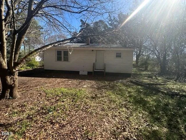 a view of a backyard of the house