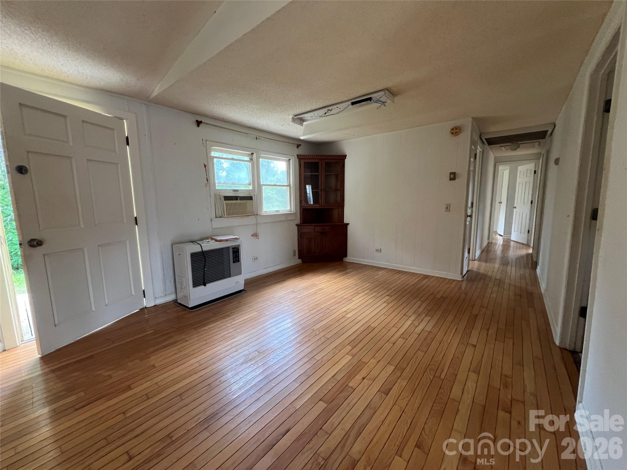 4405 Maple Creek Road Rutherfordton, NC 28139 - Photo 10 of 32 a view of an empty room with wooden floor and a window