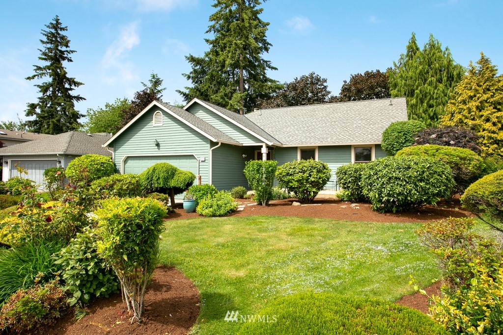 121 Union Court Northeast Renton, WA 98059 - Photo 1 of 21 a view of a house with a yard and potted plants