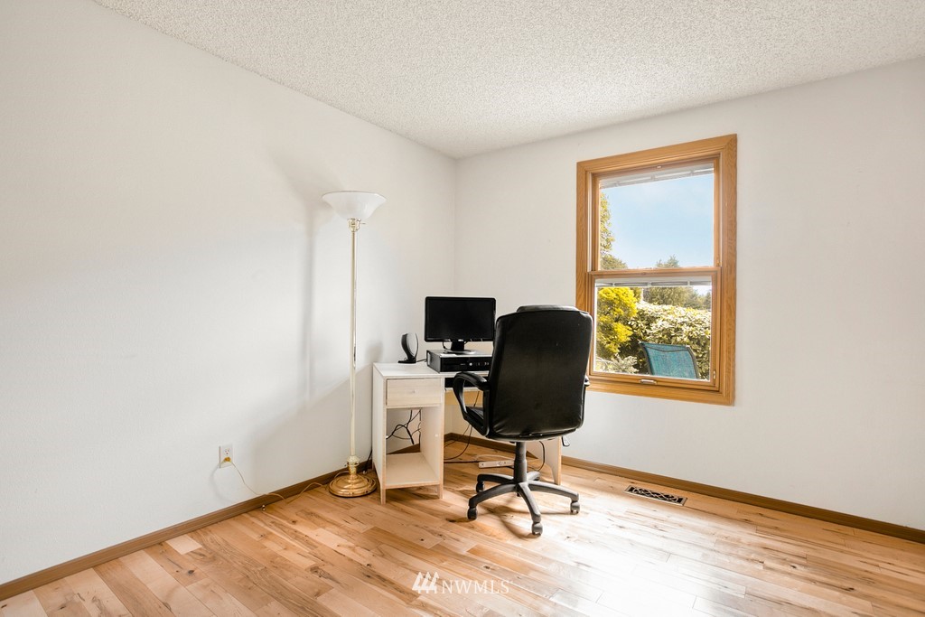 121 Union Court Northeast Renton, WA 98059 - Photo 15 of 21 a view of workspace with wooden floor windows