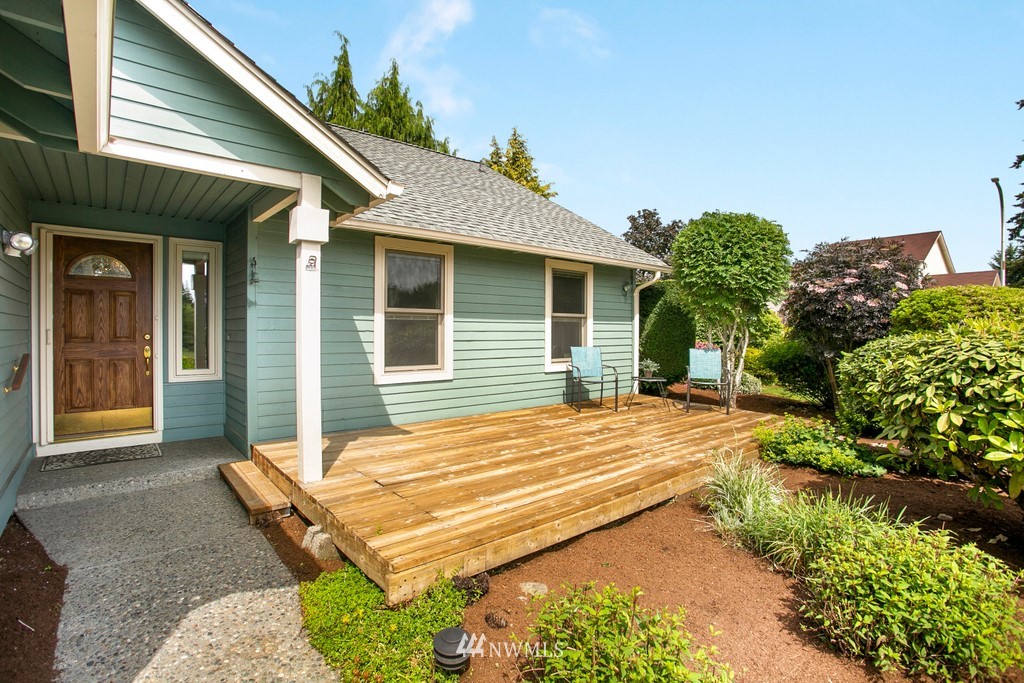 121 Union Court Northeast Renton, WA 98059 - Photo 3 of 21 a backyard of a house with yard and outdoor seating