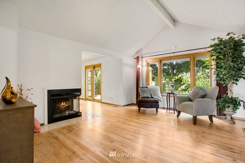121 Union Court Northeast Renton, WA 98059 - Photo 4 of 21 a living room with furniture and a fireplace