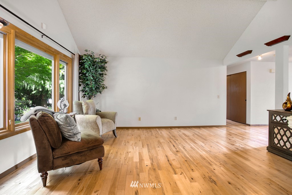 121 Union Court Northeast Renton, WA 98059 - Photo 6 of 21 a living room with furniture and a wooden floor