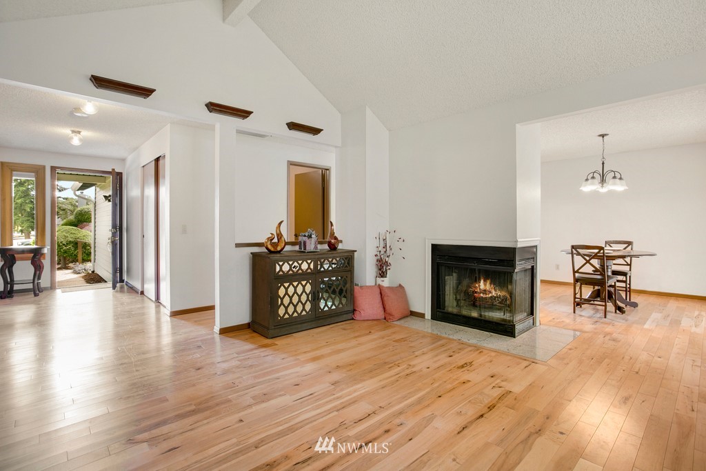121 Union Court Northeast Renton, WA 98059 - Photo 7 of 21 a living room with furniture and a fireplace