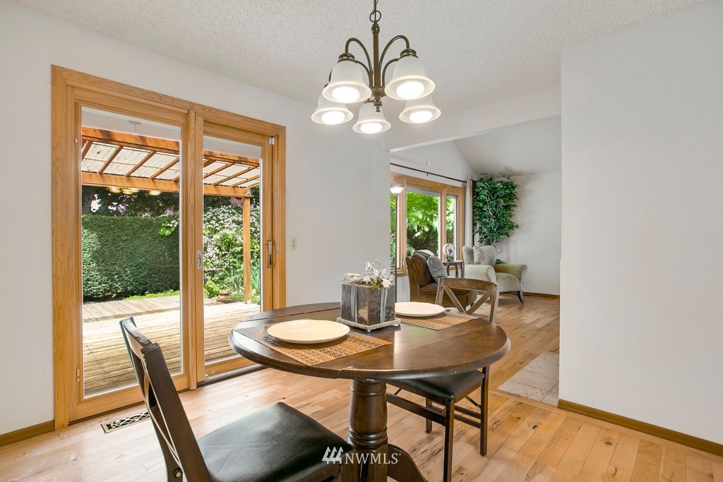 121 Union Court Northeast Renton, WA 98059 - Photo 8 of 21 a view of a dining room with a table and chairs