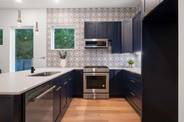 a kitchen with a sink and cabinets