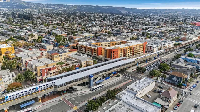 a living room with furniture and a book shelf