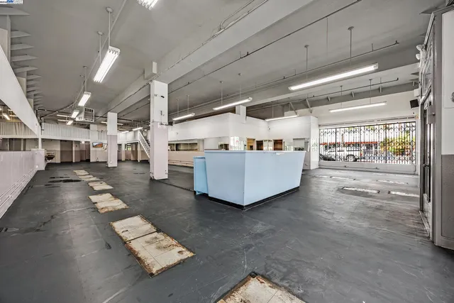 a living room with stainless steel appliances kitchen island granite countertop a living room view