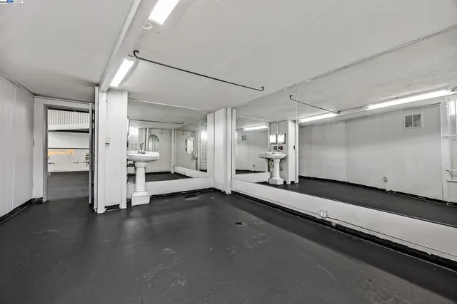 a kitchen with cabinets and white appliances