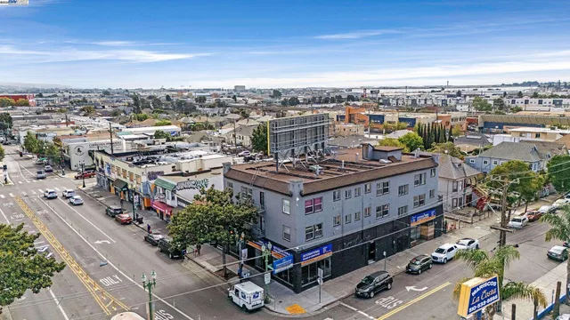 an aerial view of a multi story parking building with yard