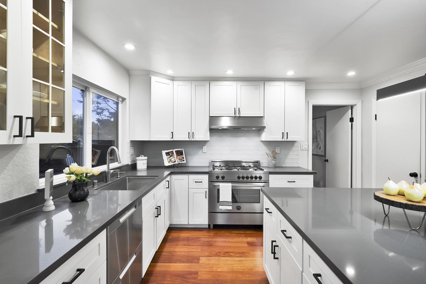 20 Tea Tree Court Hillsborough, CA 94010 - Photo 41 of 100 a kitchen with stainless steel appliances granite countertop a sink a stove and a refrigerator