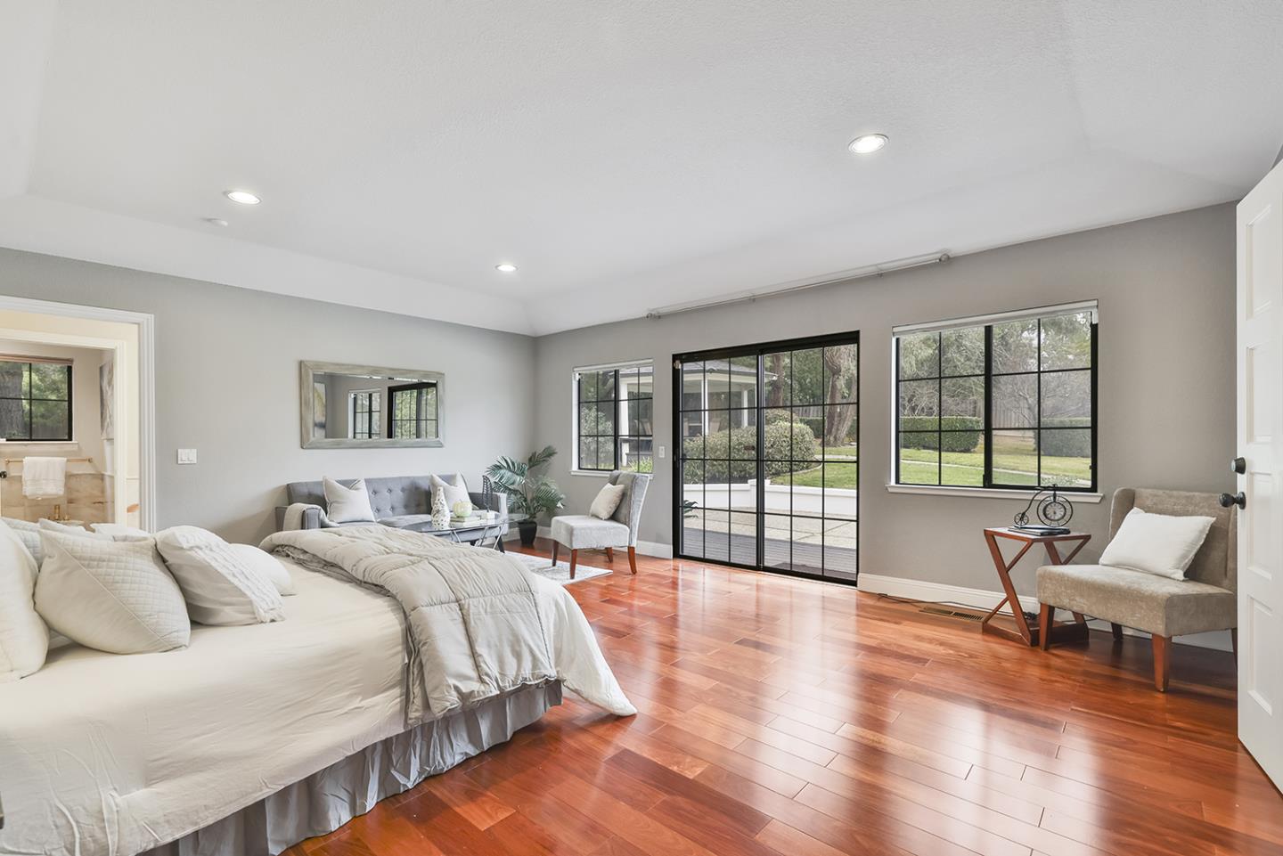 20 Tea Tree Court Hillsborough, CA 94010 - Photo 63 of 100 a spacious bedroom with a large bed and a large window