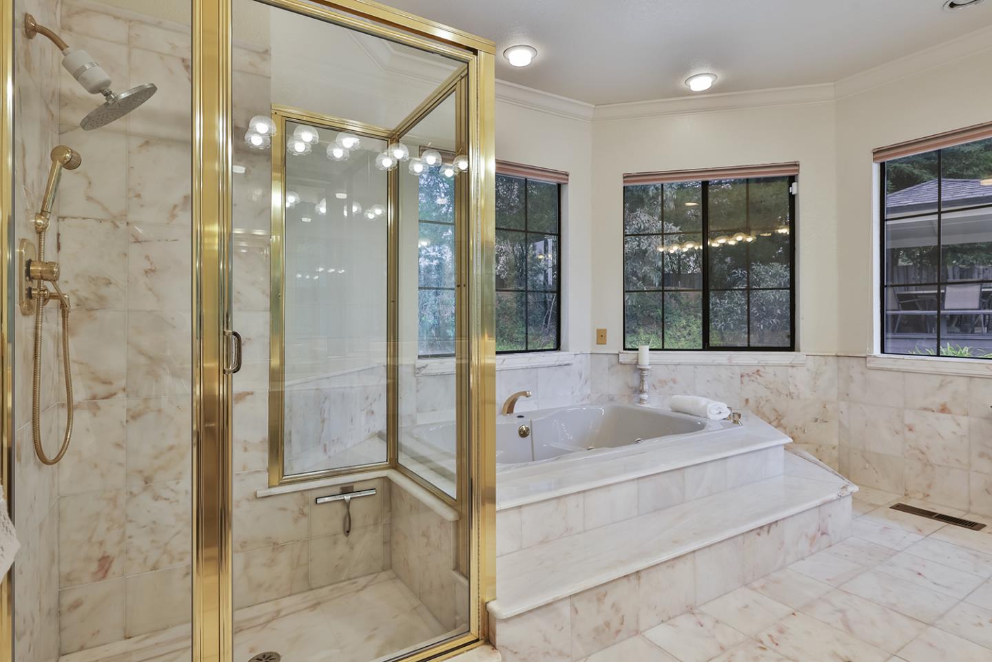 20 Tea Tree Court Hillsborough, CA 94010 - Photo 65 of 100 a bathroom with a tub shower and sink