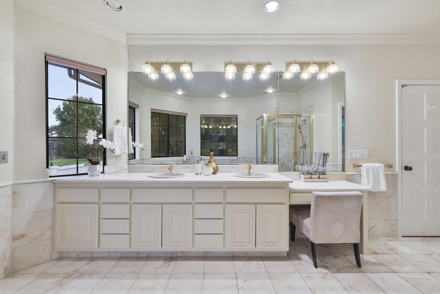 20 Tea Tree Court Hillsborough, CA 94010 - Photo 69 of 100 a bathroom with a sink and a mirror