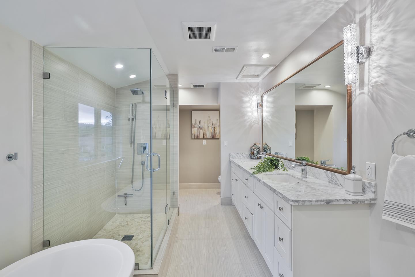 20 Tea Tree Court Hillsborough, CA 94010 - Photo 85 of 100 a spacious bathroom with a granite countertop sink mirror and a shower