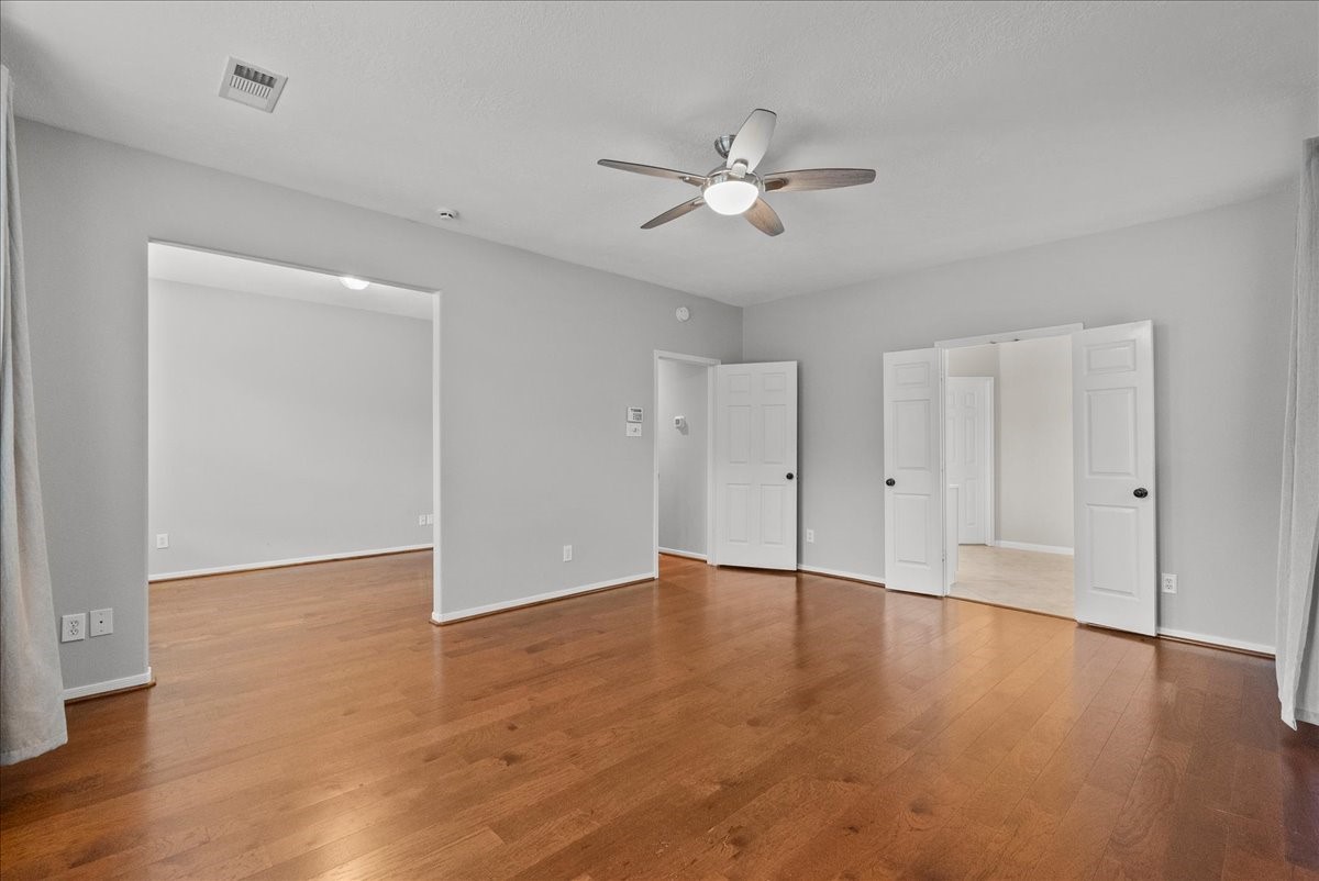 2876 Match Point Lane Friendswood, TX 77546 - Photo 19 of 45 This primary offers sweeping views of the pool through a wall of windows.