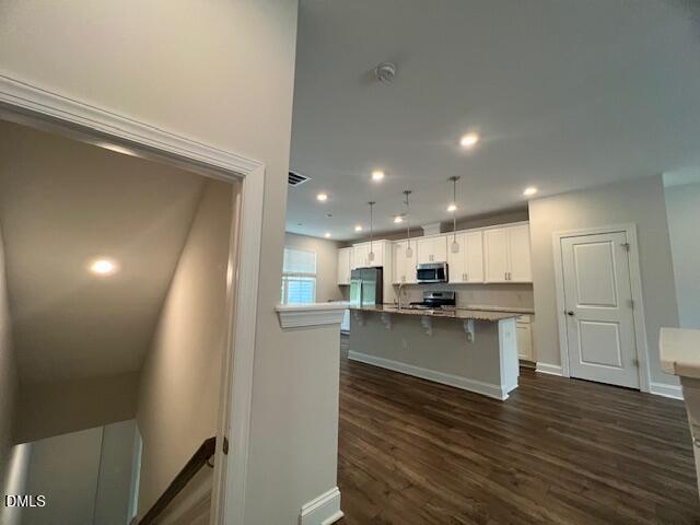 2819 Macbeth Lane Apex, NC 27502 - Photo 14 of 62 a kitchen with a sink and microwave