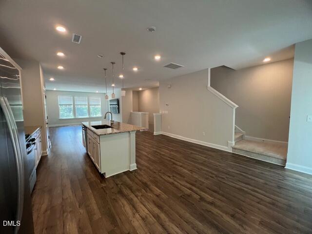 2819 Macbeth Lane Apex, NC 27502 - Photo 21 of 62 a living room with furniture and a wooden floor