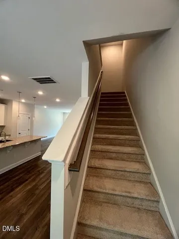 an empty room with closet and bathroom