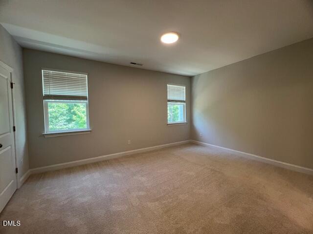2819 Macbeth Lane Apex, NC 27502 - Photo 25 of 62 an empty room with windows
