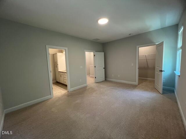 2819 Macbeth Lane Apex, NC 27502 - Photo 26 of 62 an empty room with closet and bathroom