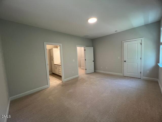 2819 Macbeth Lane Apex, NC 27502 - Photo 27 of 62 an empty room with closet area and windows