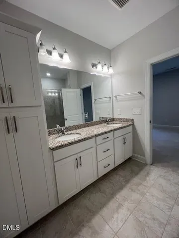 an empty room with an empty space and windows