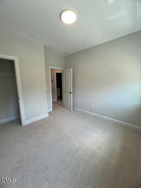 2819 Macbeth Lane Apex, NC 27502 - Photo 37 of 62 an empty room with an empty space and windows