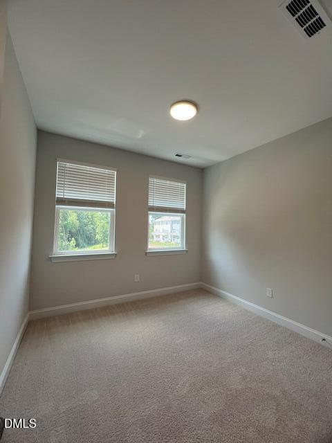 2819 Macbeth Lane Apex, NC 27502 - Photo 39 of 62 an empty room with windows