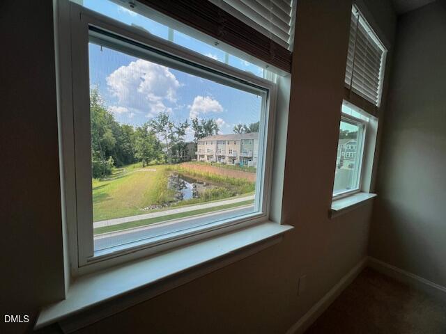 2819 Macbeth Lane Apex, NC 27502 - Photo 40 of 62 a view of a room that has a large window