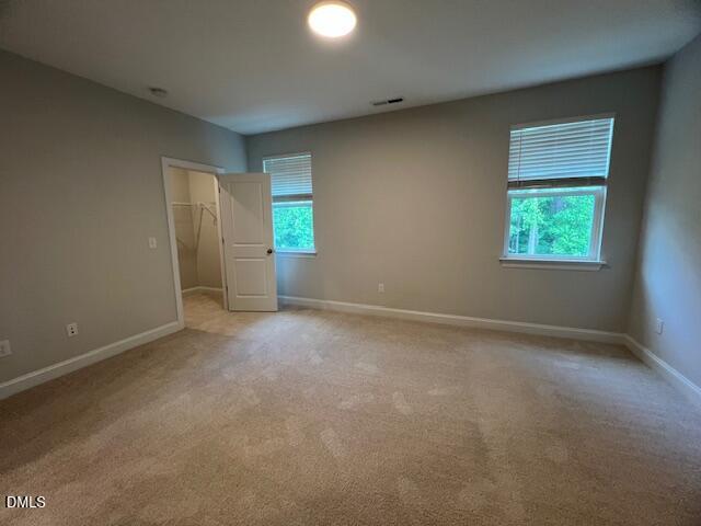 2819 Macbeth Lane Apex, NC 27502 - Photo 42 of 62 an empty room with windows and closet