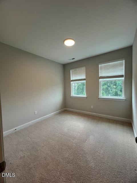 2819 Macbeth Lane Apex, NC 27502 - Photo 43 of 62 an empty room with a empty space and windows