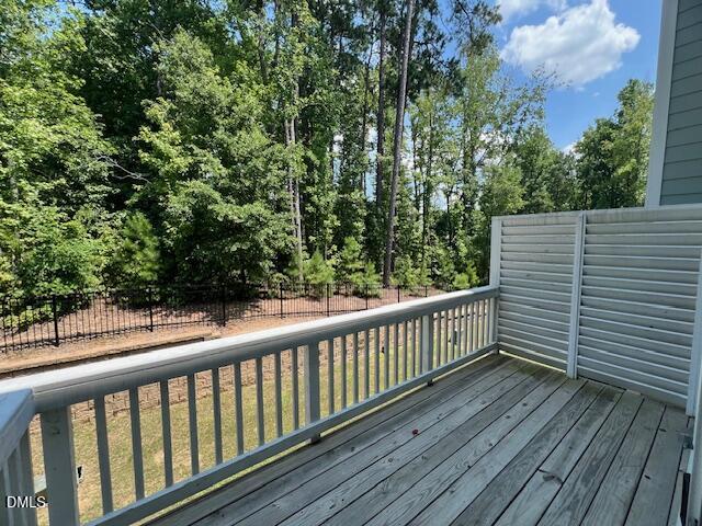 2819 Macbeth Lane Apex, NC 27502 - Photo 45 of 62 a balcony with wooden floor and fence