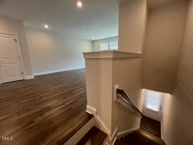 a view of kitchen with cabinets and wooden floor