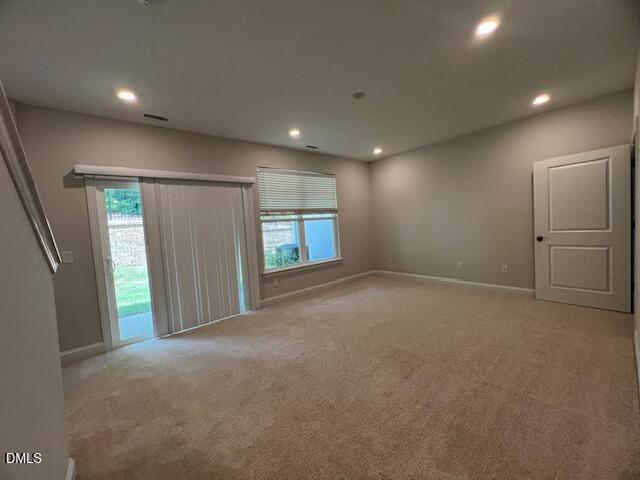 2819 Macbeth Lane Apex, NC 27502 - Photo 52 of 62 a view of an empty room with a fireplace