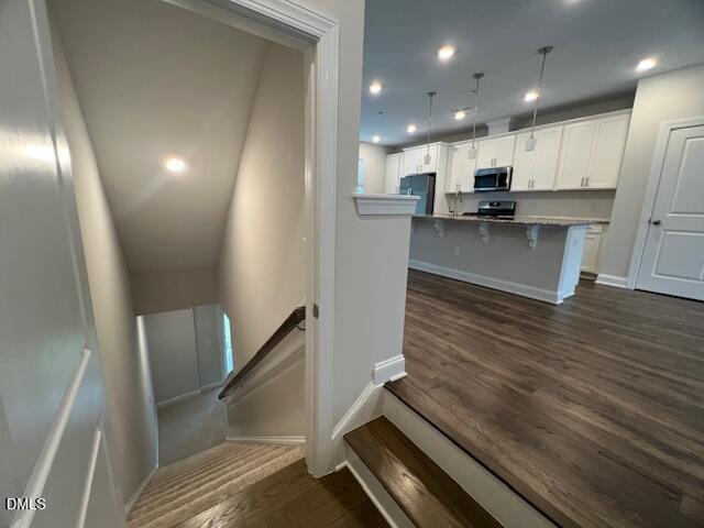 2819 Macbeth Lane Apex, NC 27502 - Photo 5 of 62 a view of kitchen with cabinets and wooden floor