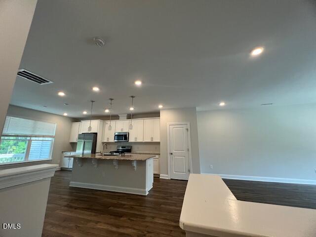 2819 Macbeth Lane Apex, NC 27502 - Photo 7 of 62 a view of kitchen with kitchen island sink refrigerator and stove