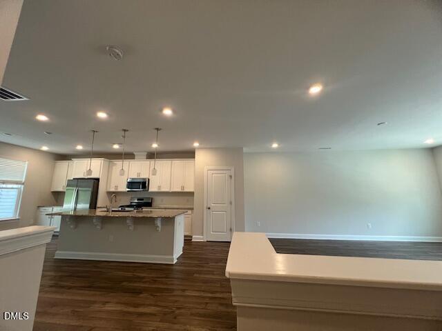 2819 Macbeth Lane Apex, NC 27502 - Photo 8 of 62 a view of kitchen with wooden floor