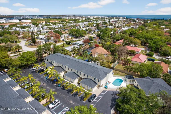 an aerial view of residential houses with outdoor space