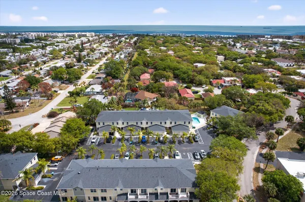 an aerial view of a house with a swimming pool
