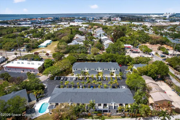 an aerial view of residential houses with outdoor space