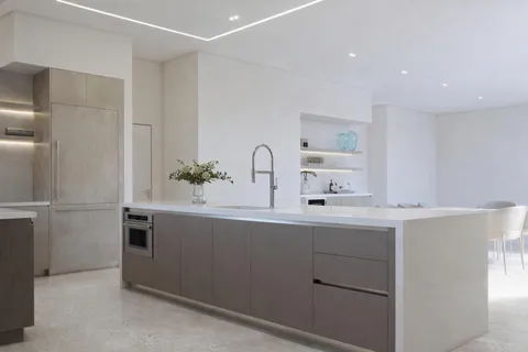 a kitchen with a sink and cabinets