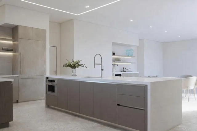 a kitchen with a sink and cabinets