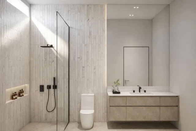 a bathroom with a double vanity sink mirror and toilet